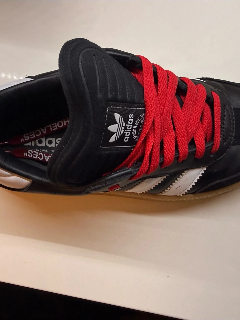 adidas  Black Sneakers with Red Laces and White Stripes